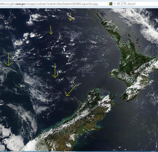 New year's day. Image from Aqua shows aerosol trails over the Tasman sea to the west of New Zealand.  Click to enlarge. Full image: http://rapidfire.sci.gsfc.nasa.gov/imagery/subsets/?subset=NewZealand.2015001.aqua.2km.jpg